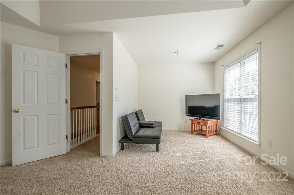 5511 Alexandrite Way Fort Mill, SC 29708 - Photo 16 of 32 a view of a livingroom with a flat screen tv and a window