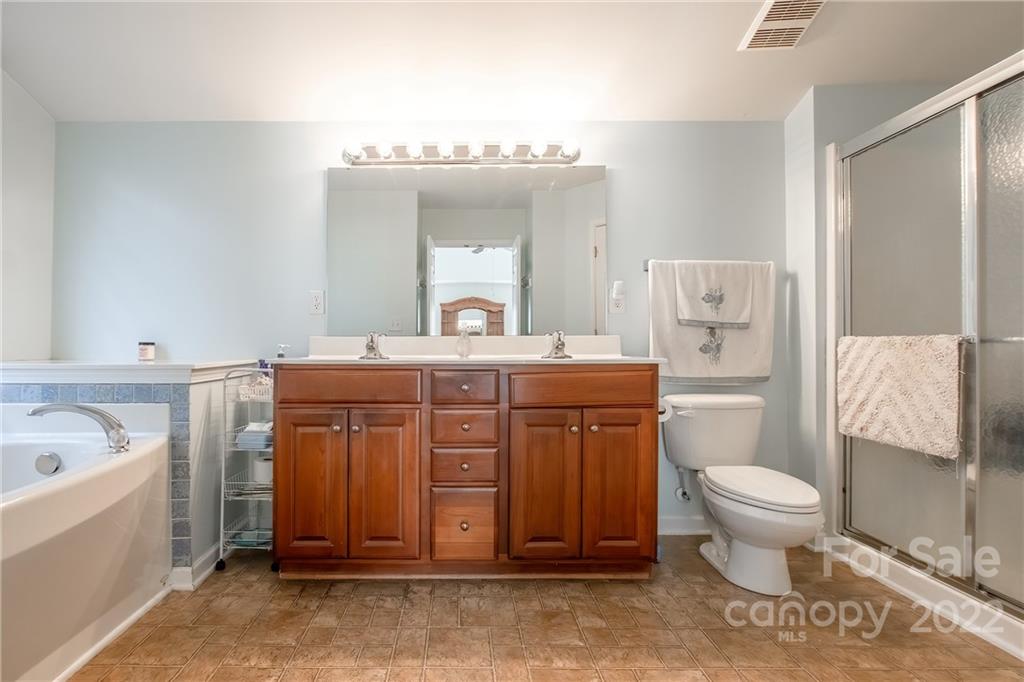 5511 Alexandrite Way Fort Mill, SC 29708 - Photo 17 of 32 a bathroom with a sink toilet and tub