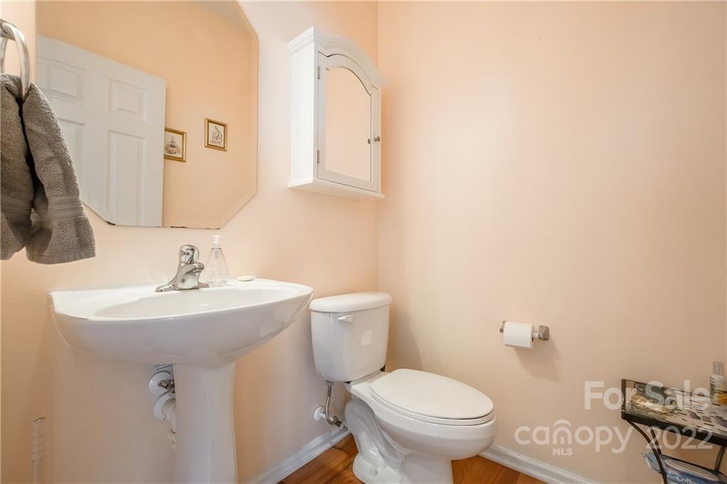 5511 Alexandrite Way Fort Mill, SC 29708 - Photo 25 of 32 a bathroom with a toilet sink and mirror