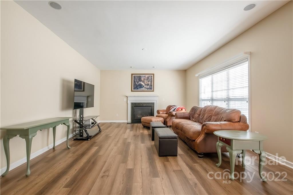 5511 Alexandrite Way Fort Mill, SC 29708 - Photo 3 of 32 a living room with furniture and a flat screen tv