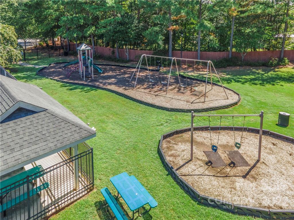5511 Alexandrite Way Fort Mill, SC 29708 - Photo 31 of 32 a view of a backyard with sitting area