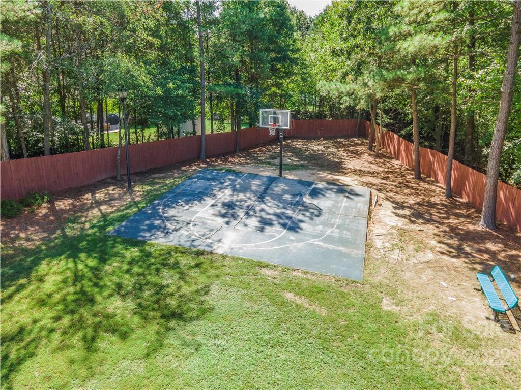 5511 Alexandrite Way Fort Mill, SC 29708 - Photo 32 of 32 a view of a backyard with trees