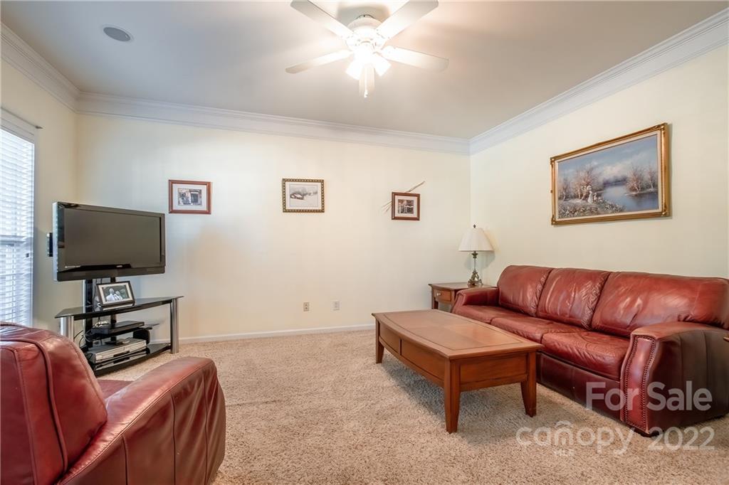 5511 Alexandrite Way Fort Mill, SC 29708 - Photo 5 of 32 a living room with furniture and a flat screen tv