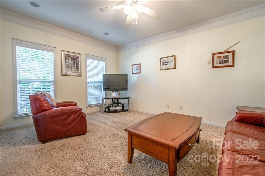 5511 Alexandrite Way Fort Mill, SC 29708 - Photo 6 of 32 a living room with furniture and a flat screen tv