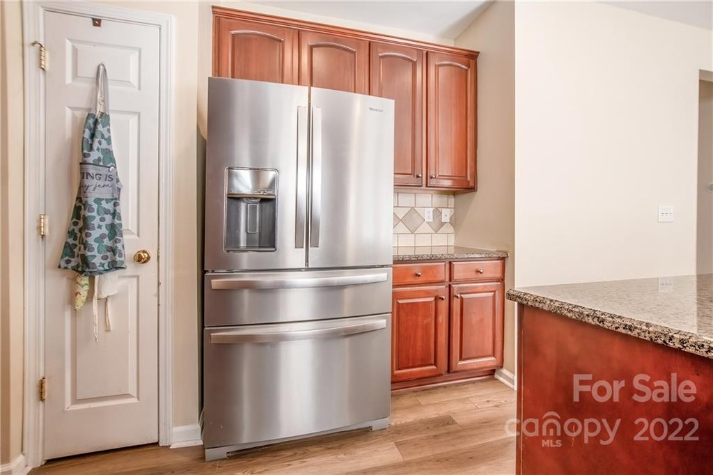 5511 Alexandrite Way Fort Mill, SC 29708 - Photo 10 of 32 a kitchen with stainless steel appliances granite countertop a refrigerator and a stove