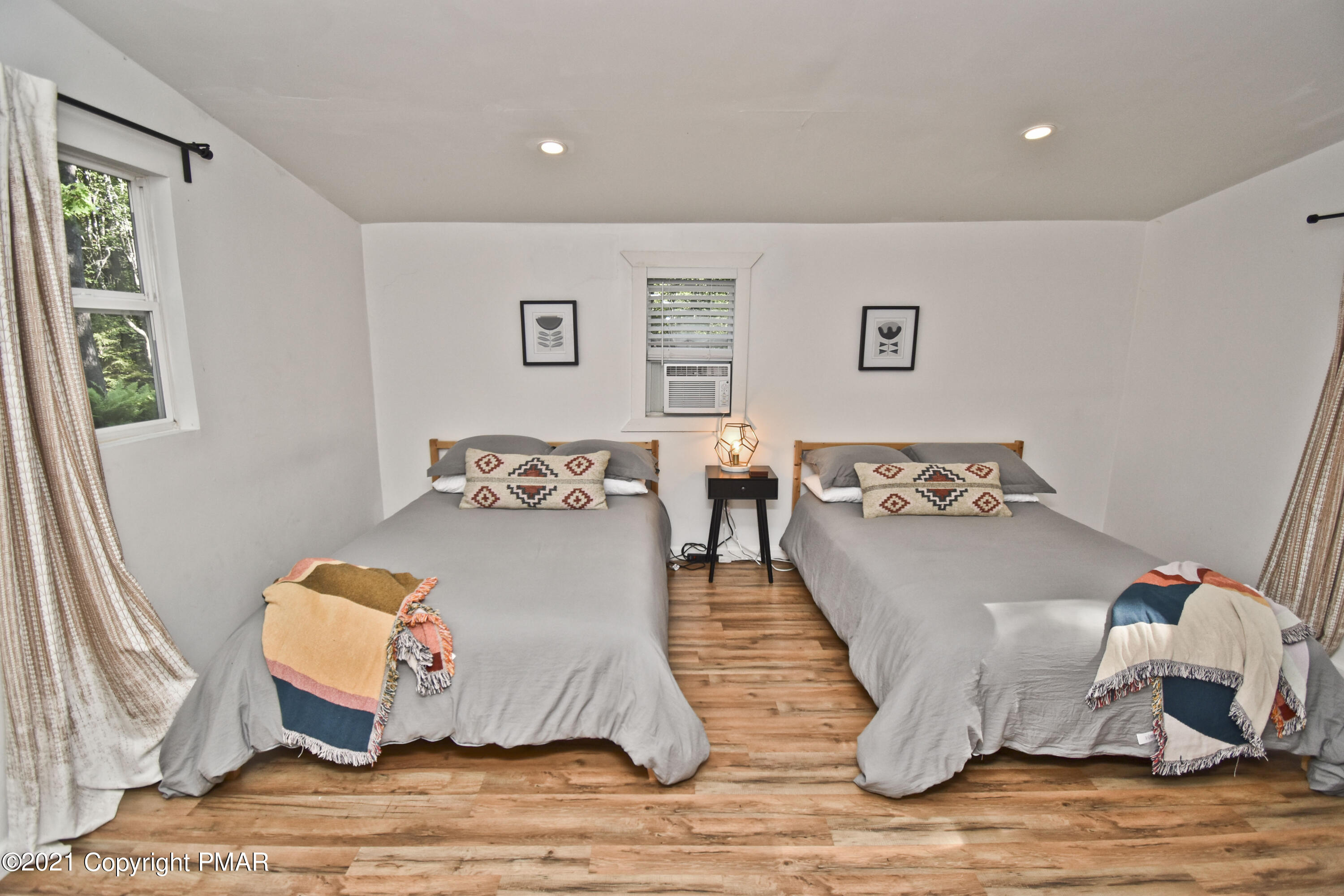 5160 Pine Tree Road Pocono Summit, PA 18346 - Photo 20 of 48 a living room with a bed
