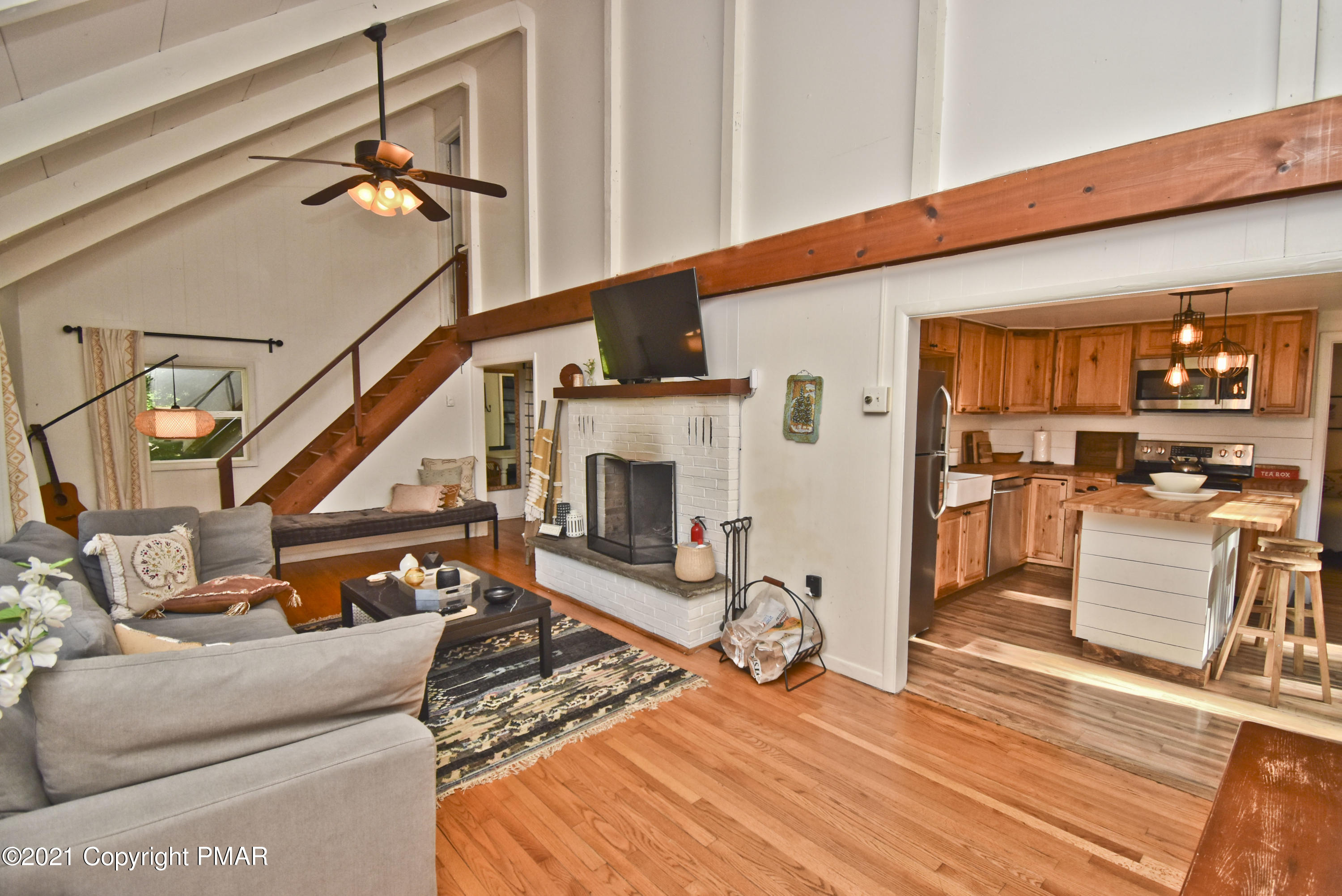 5160 Pine Tree Road Pocono Summit, PA 18346 - Photo 6 of 48 a view of a livingroom with furniture a fireplace