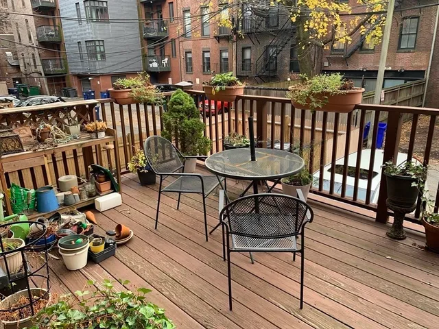 a view of a chairs on the roof deck