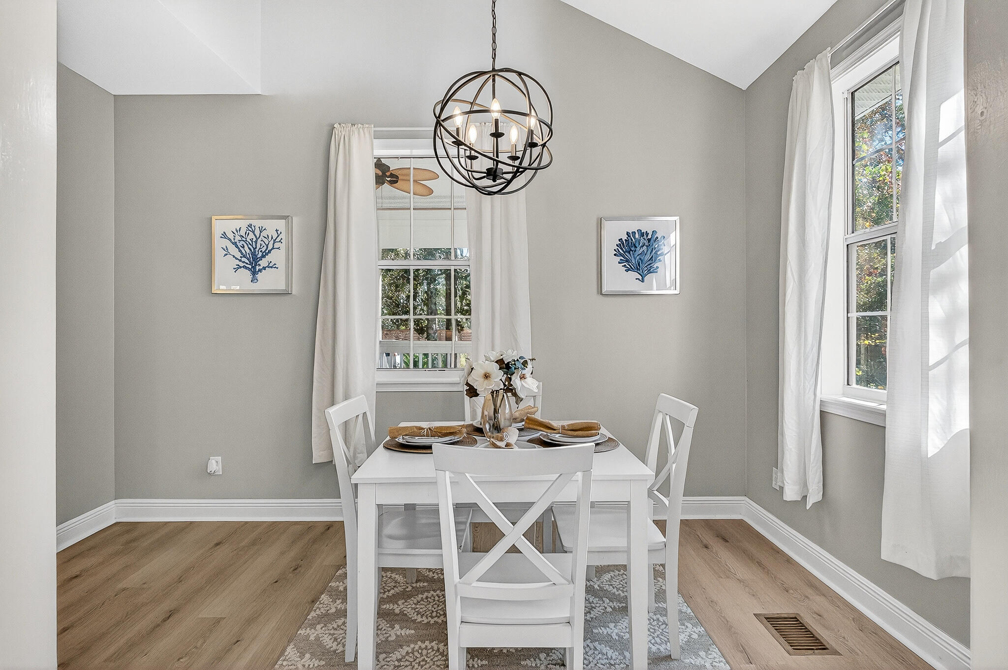 115 Central 6th Street Santa Rosa Beach, FL 32459 - Photo 11 of 56 a view of a dining room with furniture window and wooden floor