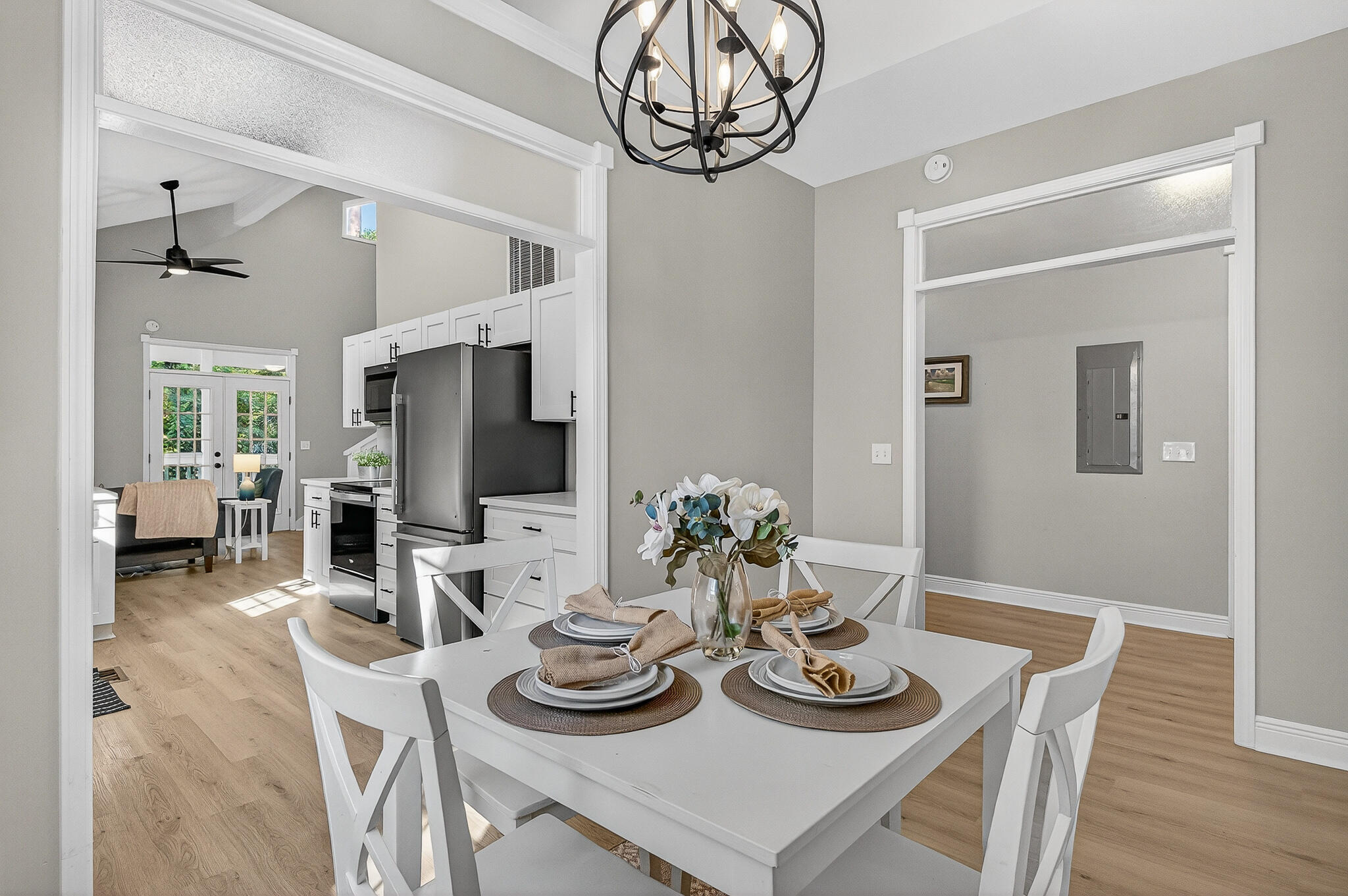 115 Central 6th Street Santa Rosa Beach, FL 32459 - Photo 12 of 56 a view of a dining room with furniture wooden floor and chandelier