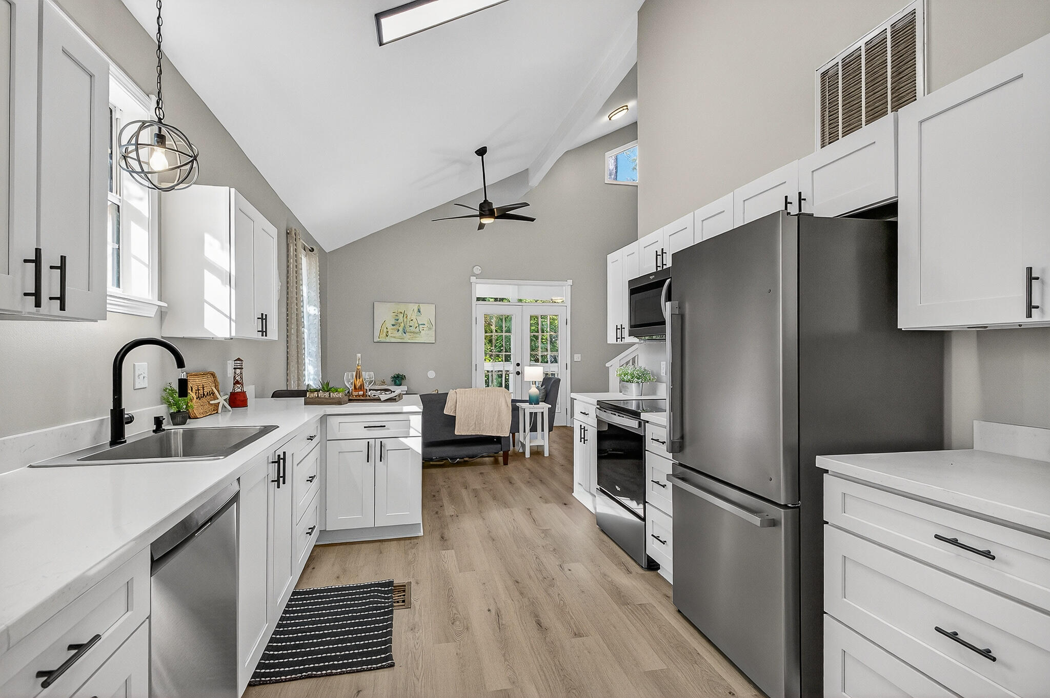 115 Central 6th Street Santa Rosa Beach, FL 32459 - Photo 13 of 56 a kitchen with a refrigerator and a sink