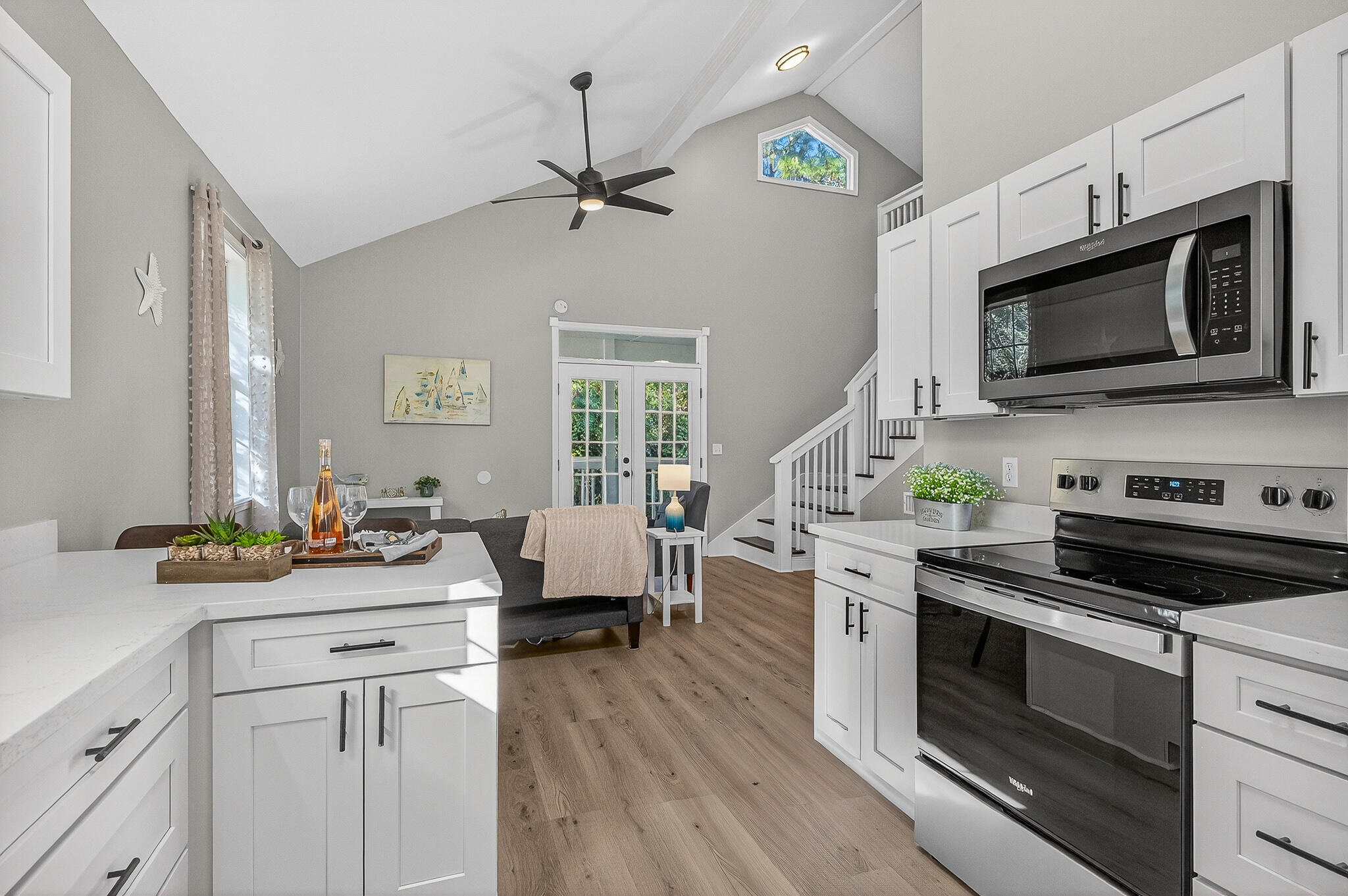 115 Central 6th Street Santa Rosa Beach, FL 32459 - Photo 17 of 56 a kitchen with a stove a sink and a microwave