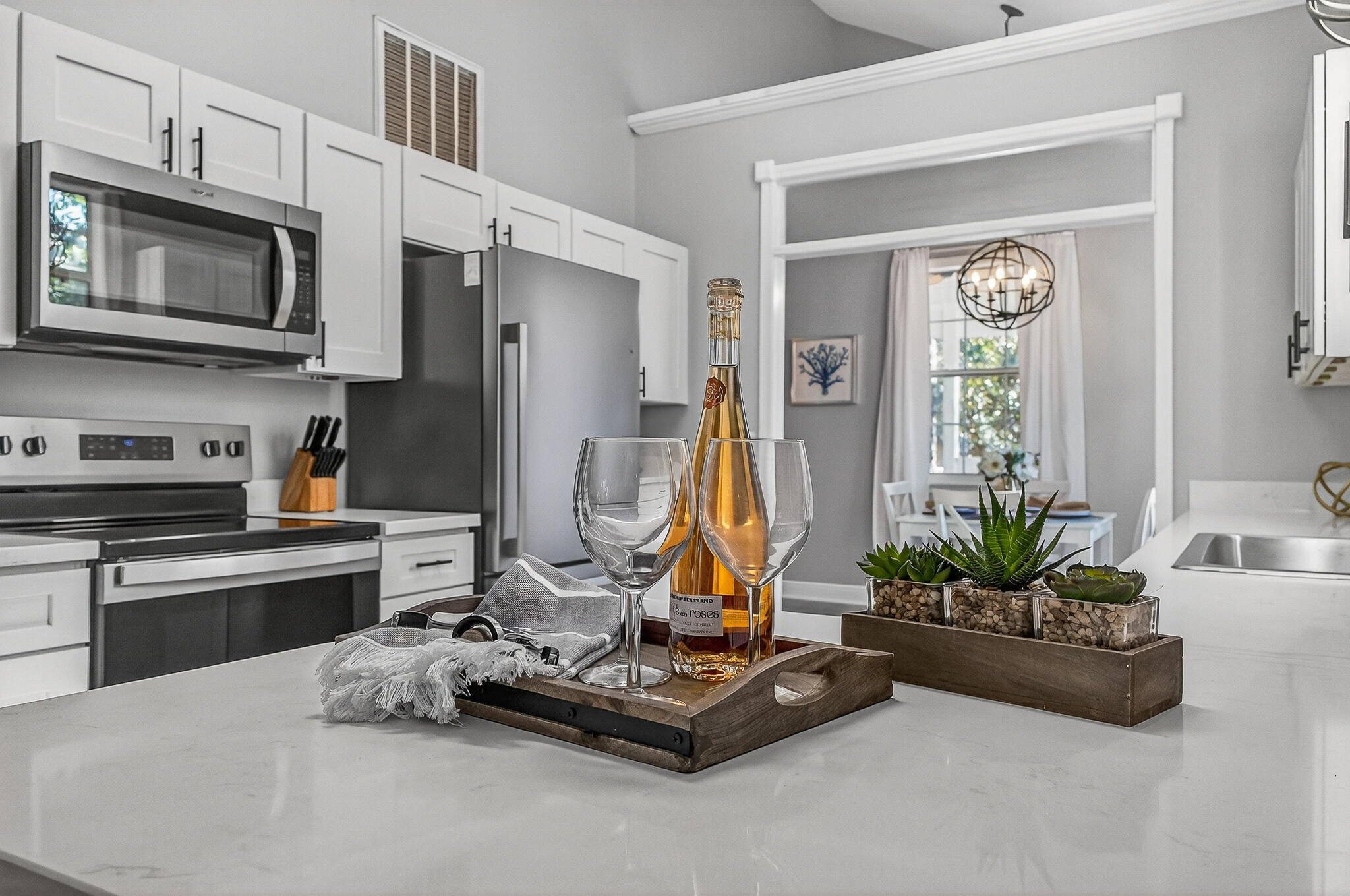 115 Central 6th Street Santa Rosa Beach, FL 32459 - Photo 20 of 56 a living room with kitchen furniture and a flat screen tv