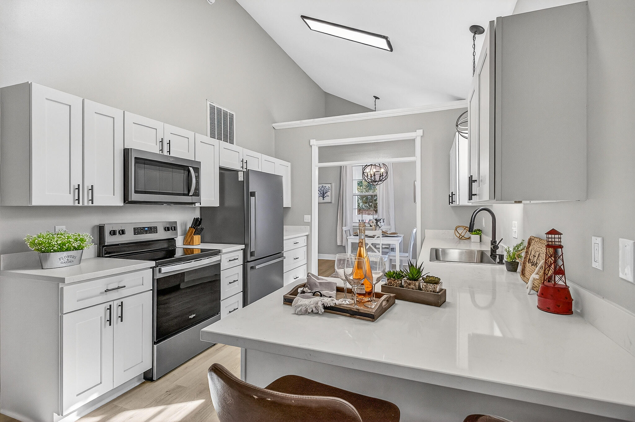 115 Central 6th Street Santa Rosa Beach, FL 32459 - Photo 21 of 56 a kitchen with sink a stove and cabinets