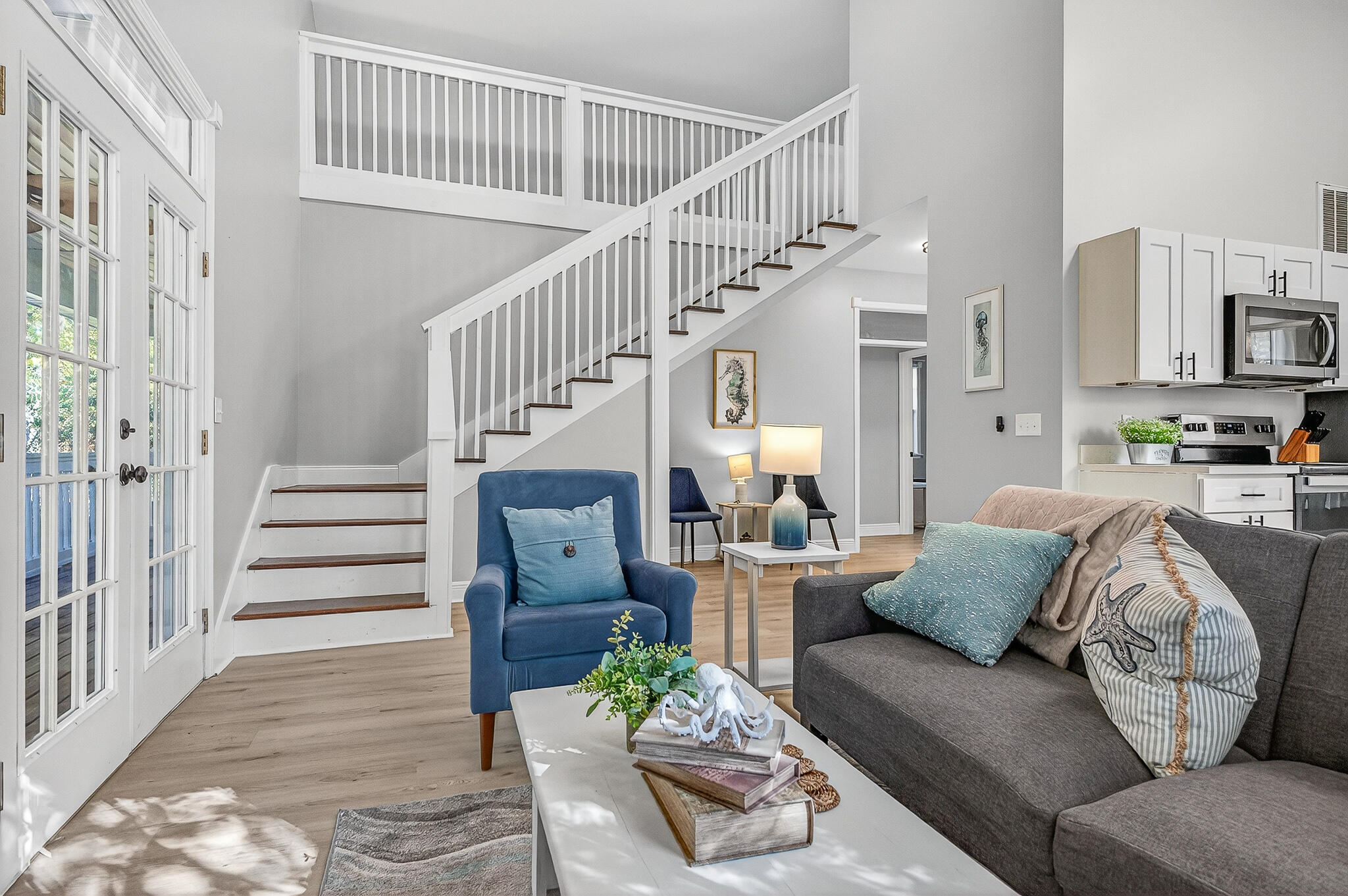 115 Central 6th Street Santa Rosa Beach, FL 32459 - Photo 26 of 56 a living room with furniture and a chandelier