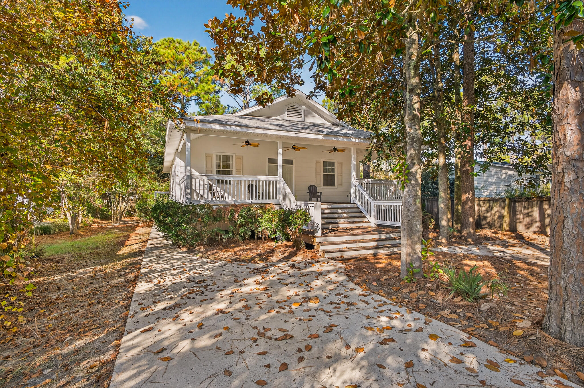 115 Central 6th Street Santa Rosa Beach, FL 32459 - Photo 3 of 56 a front view of a house with a garden