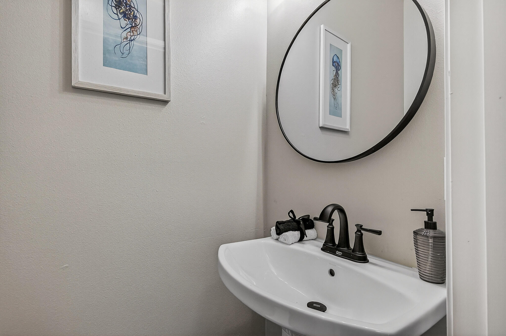 115 Central 6th Street Santa Rosa Beach, FL 32459 - Photo 39 of 56 a bathroom with a sink and a mirror