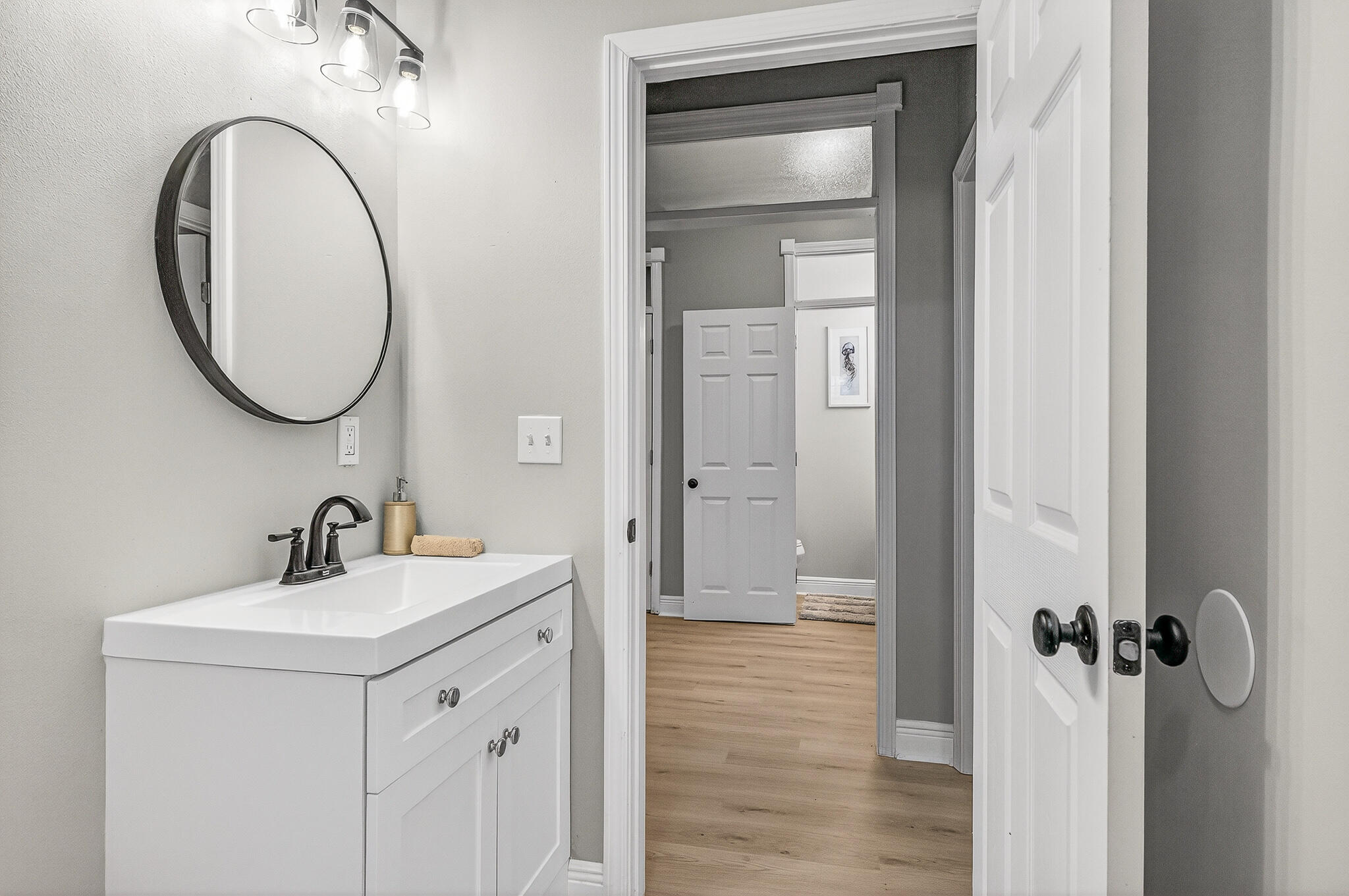 115 Central 6th Street Santa Rosa Beach, FL 32459 - Photo 42 of 56 a bathroom with a sink and a mirror