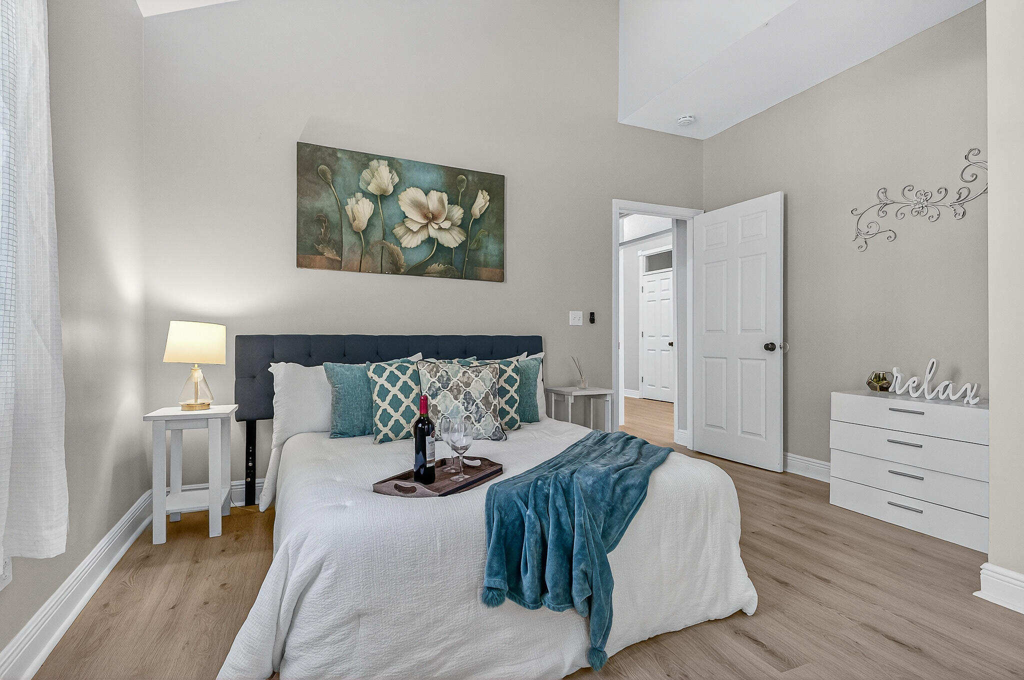 115 Central 6th Street Santa Rosa Beach, FL 32459 - Photo 48 of 56 a bedroom with a bed and a dresser