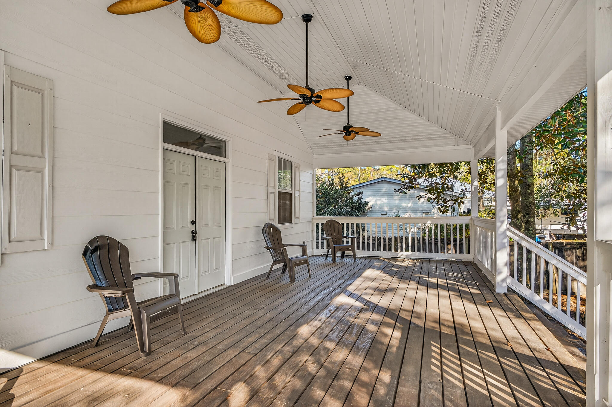 115 Central 6th Street Santa Rosa Beach, FL 32459 - Photo 5 of 56 a view of a room with furniture wooden floor and windows