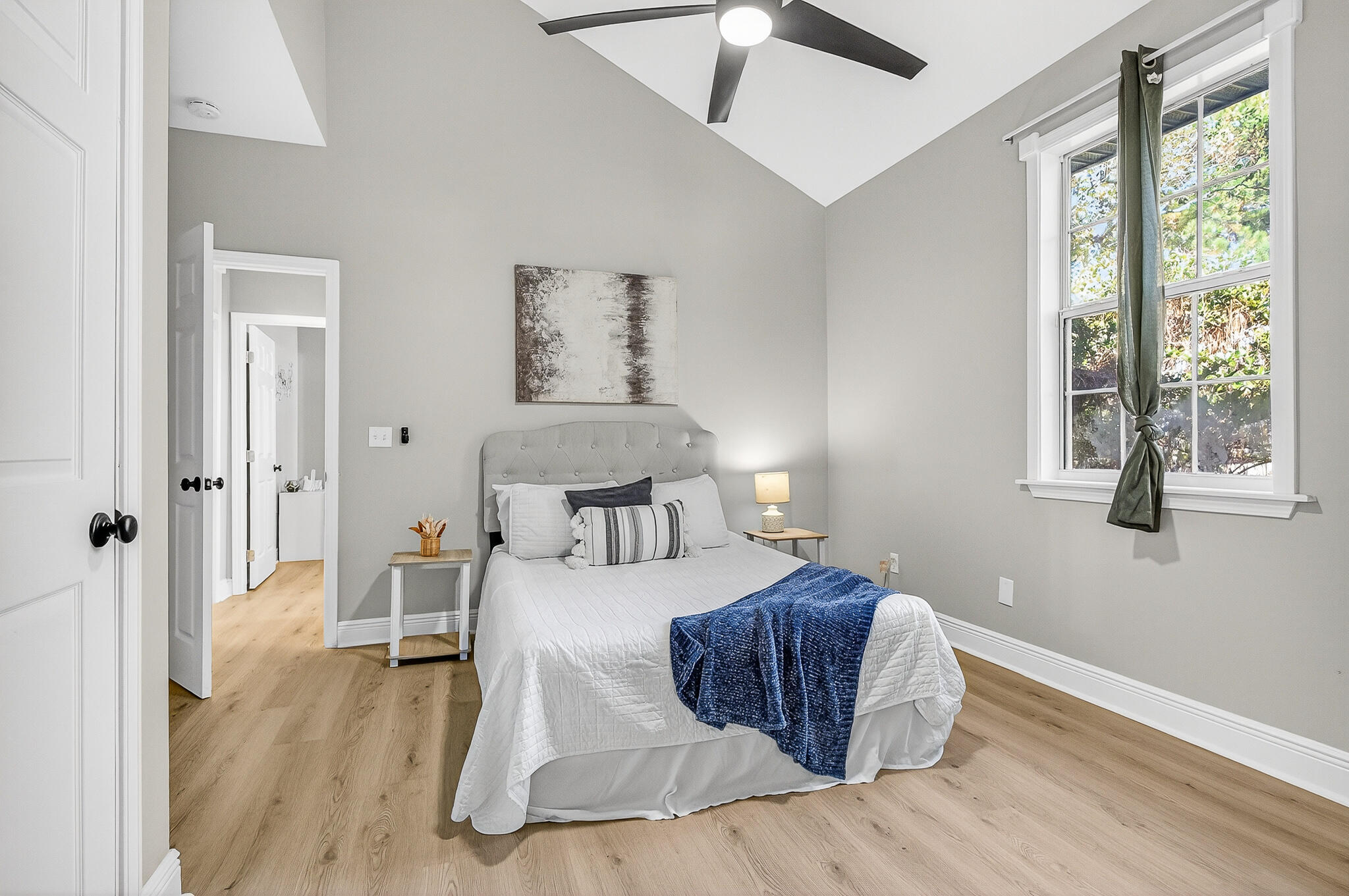 115 Central 6th Street Santa Rosa Beach, FL 32459 - Photo 52 of 56 a bedroom with a bed and wooden floor