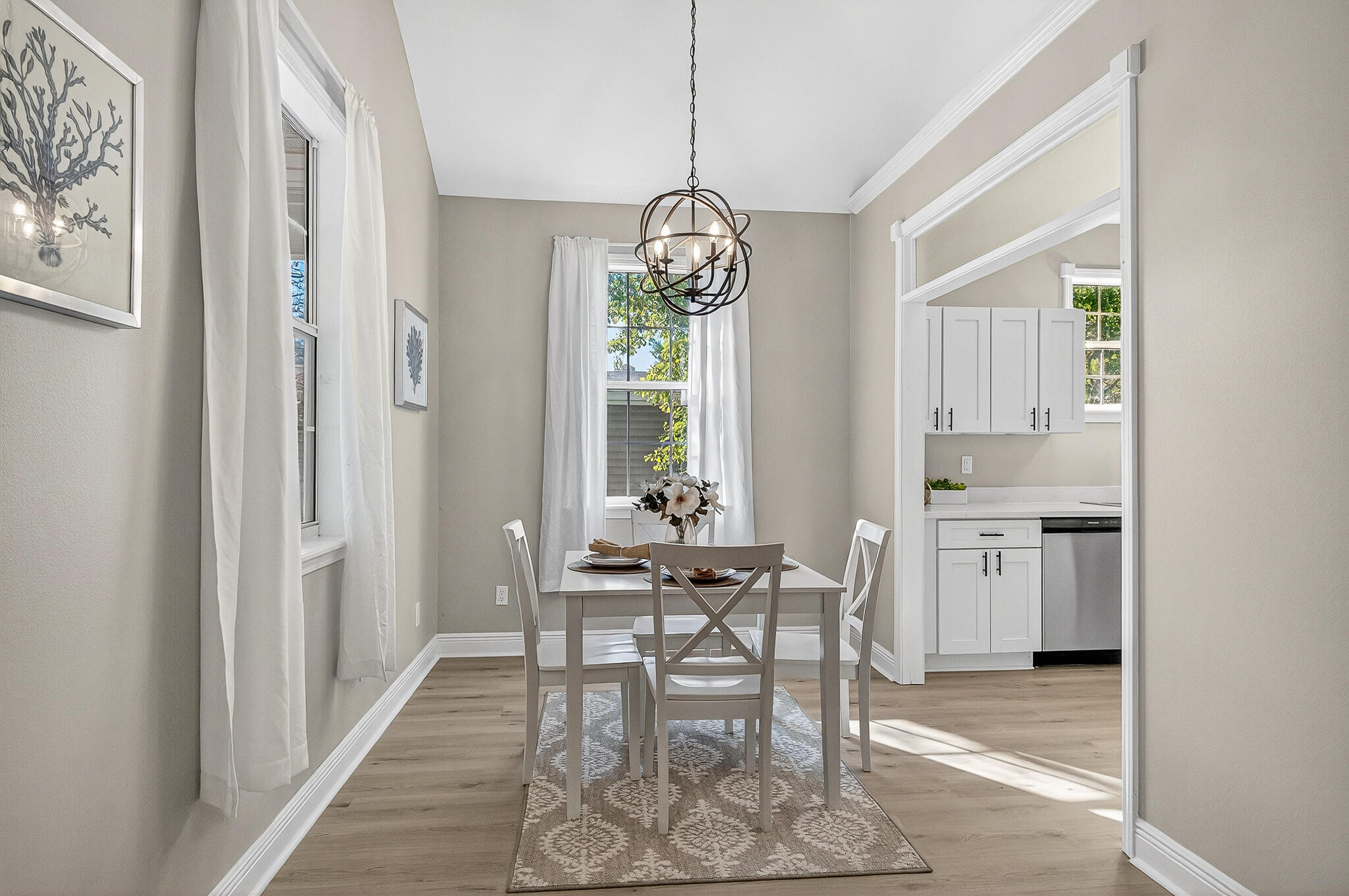 115 Central 6th Street Santa Rosa Beach, FL 32459 - Photo 10 of 56 a dining room with furniture a chandelier and wooden floor