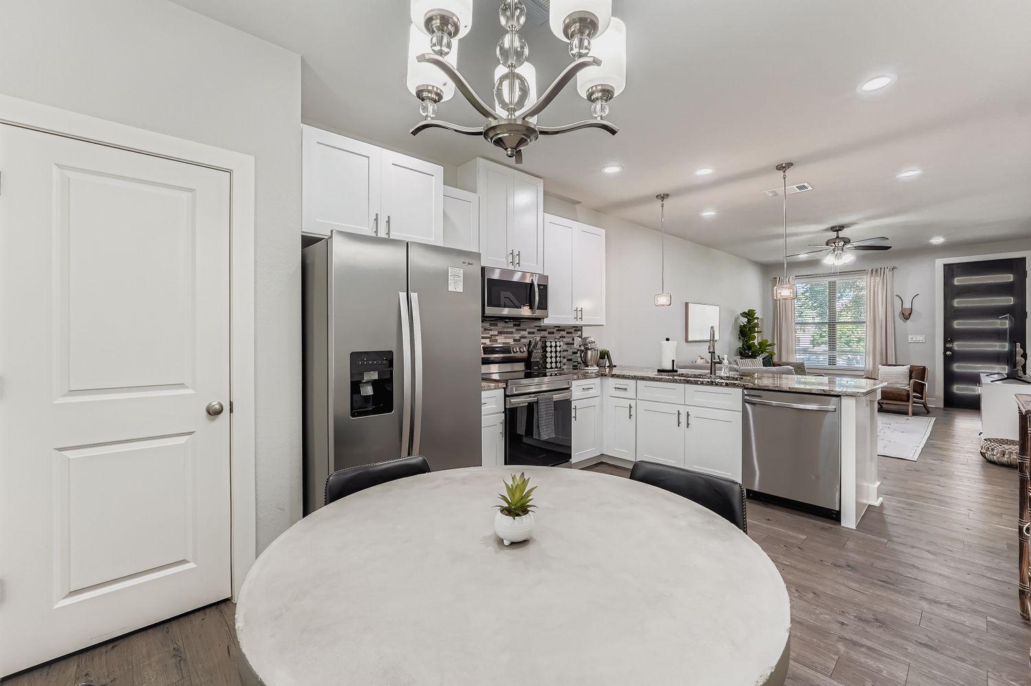 18803 Hogan Circle, Unit 14 Point Venture, TX 78645 - Photo 10 of 40 a kitchen with a refrigerator a sink and cabinets