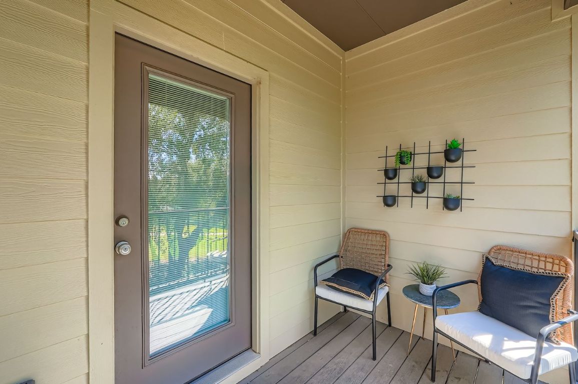 18803 Hogan Circle, Unit 14 Point Venture, TX 78645 - Photo 18 of 40 a living room with furniture and a window