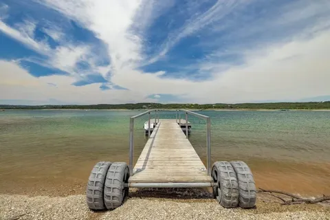 a view of swimming pool with a tree