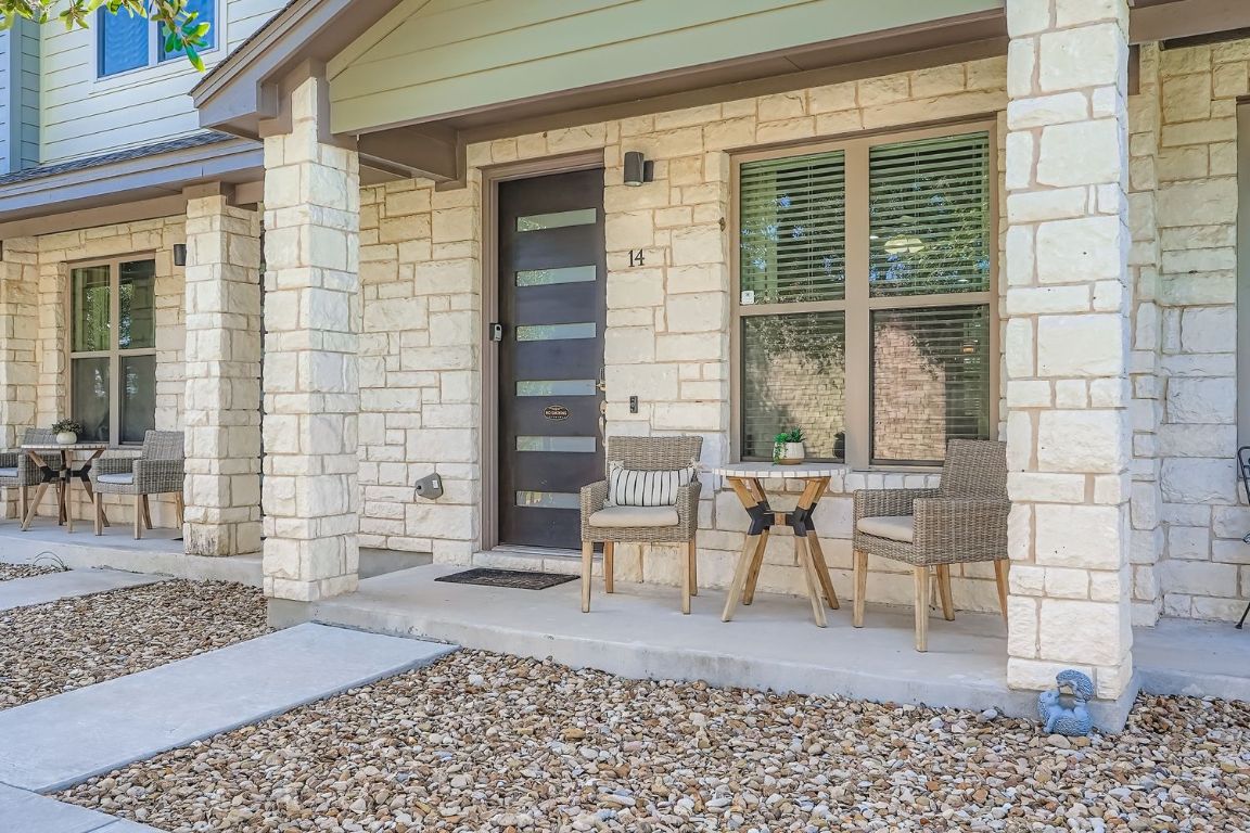 18803 Hogan Circle, Unit 14 Point Venture, TX 78645 - Photo 6 of 40 a view of a patio with table and chairs with wooden floor