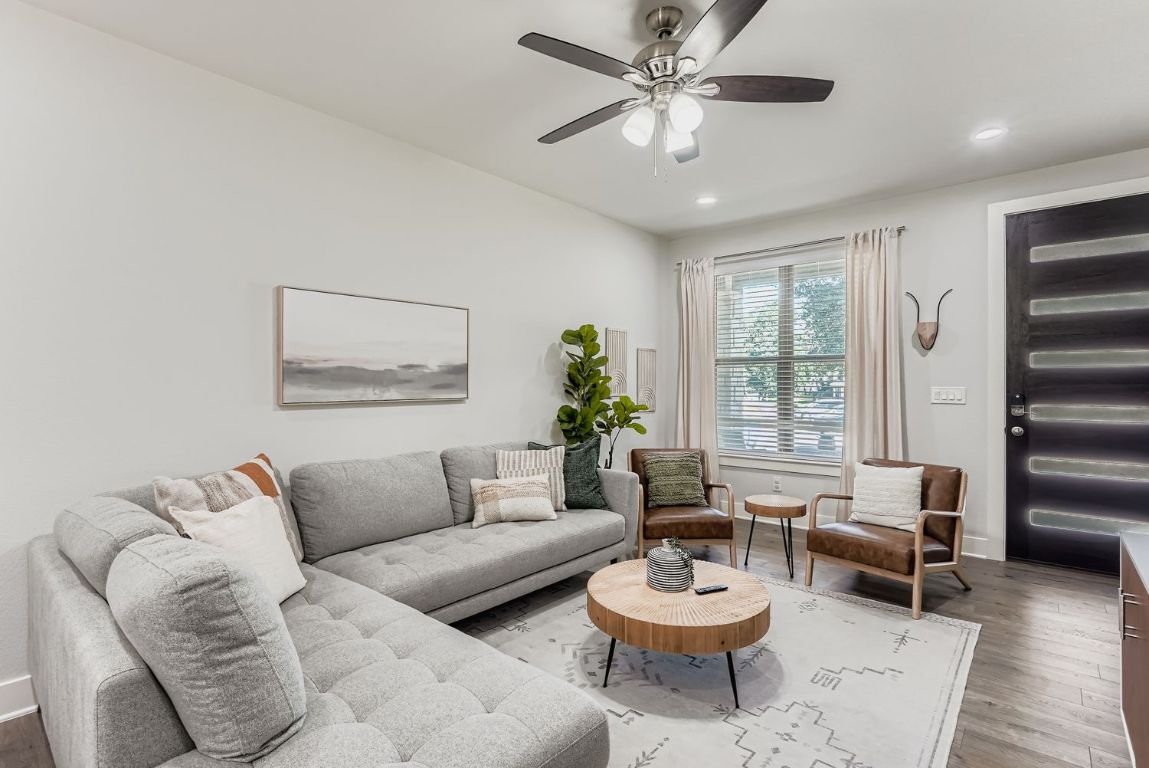 18803 Hogan Circle, Unit 14 Point Venture, TX 78645 - Photo 9 of 40 a living room with furniture and a large window