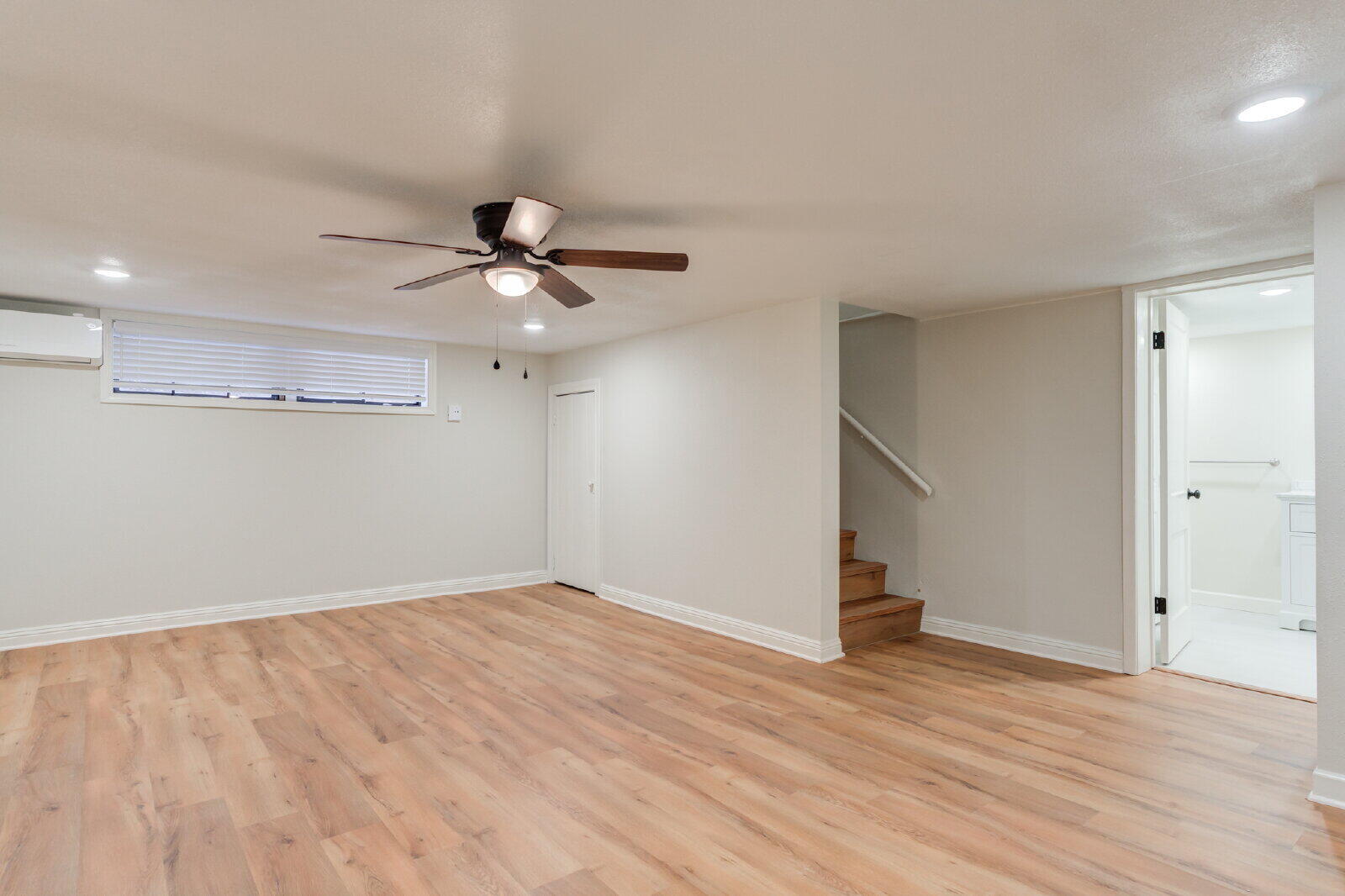 2602 24th Street Lubbock, TX 79410 - Photo 23 of 37 an empty room with wooden floor and ceiling fan