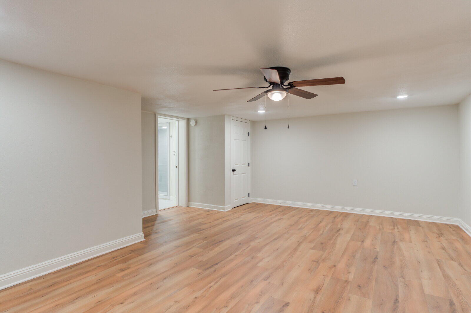 2602 24th Street Lubbock, TX 79410 - Photo 24 of 37 wooden floor in an empty room with a window