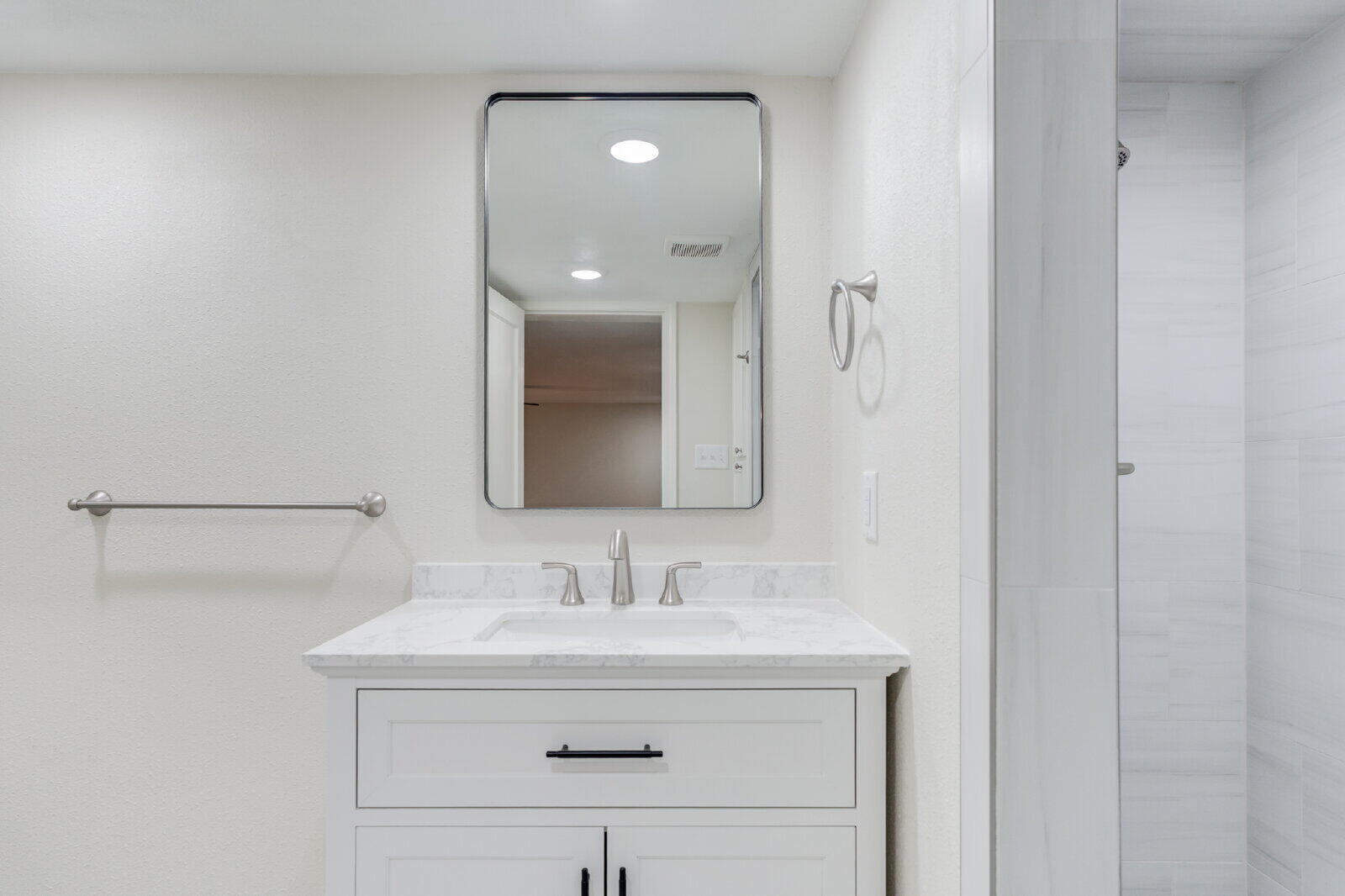 2602 24th Street Lubbock, TX 79410 - Photo 28 of 37 a bathroom with a sink and a mirror