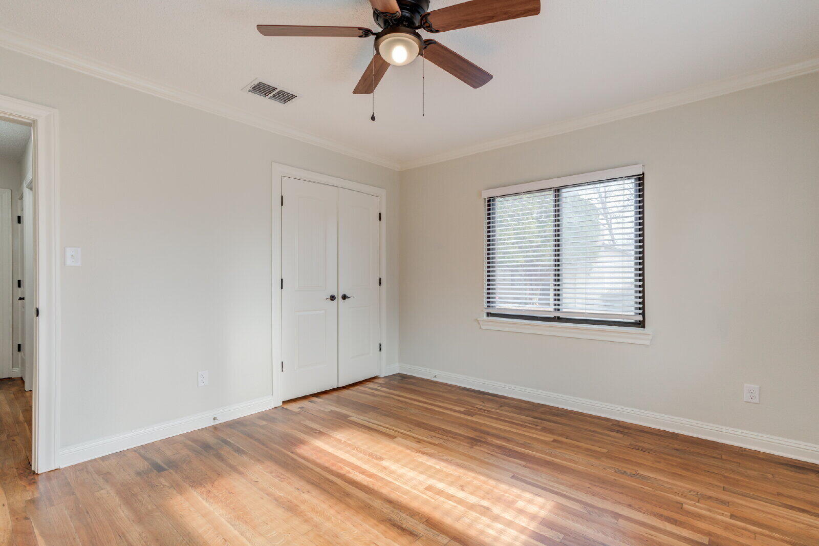 2602 24th Street Lubbock, TX 79410 - Photo 30 of 37 a view of empty room with wooden floor and fan