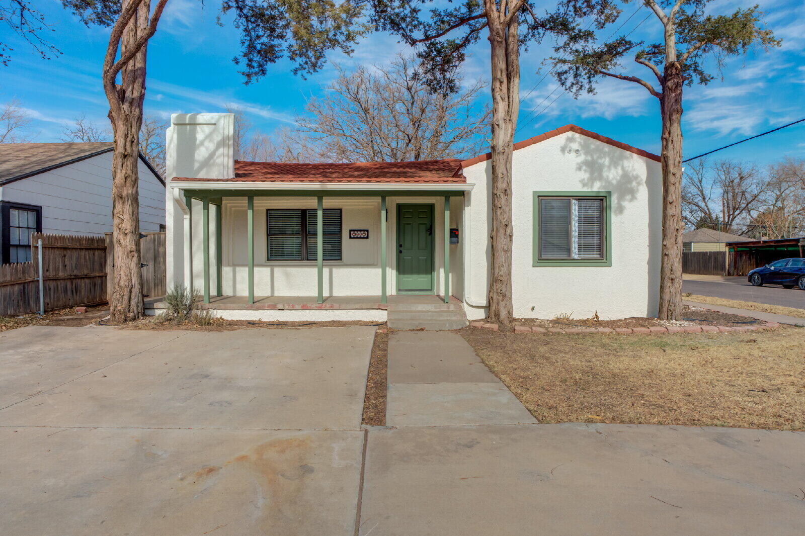 2602 24th Street Lubbock, TX 79410 - Photo 3 of 37 a view of a white house with a large tree