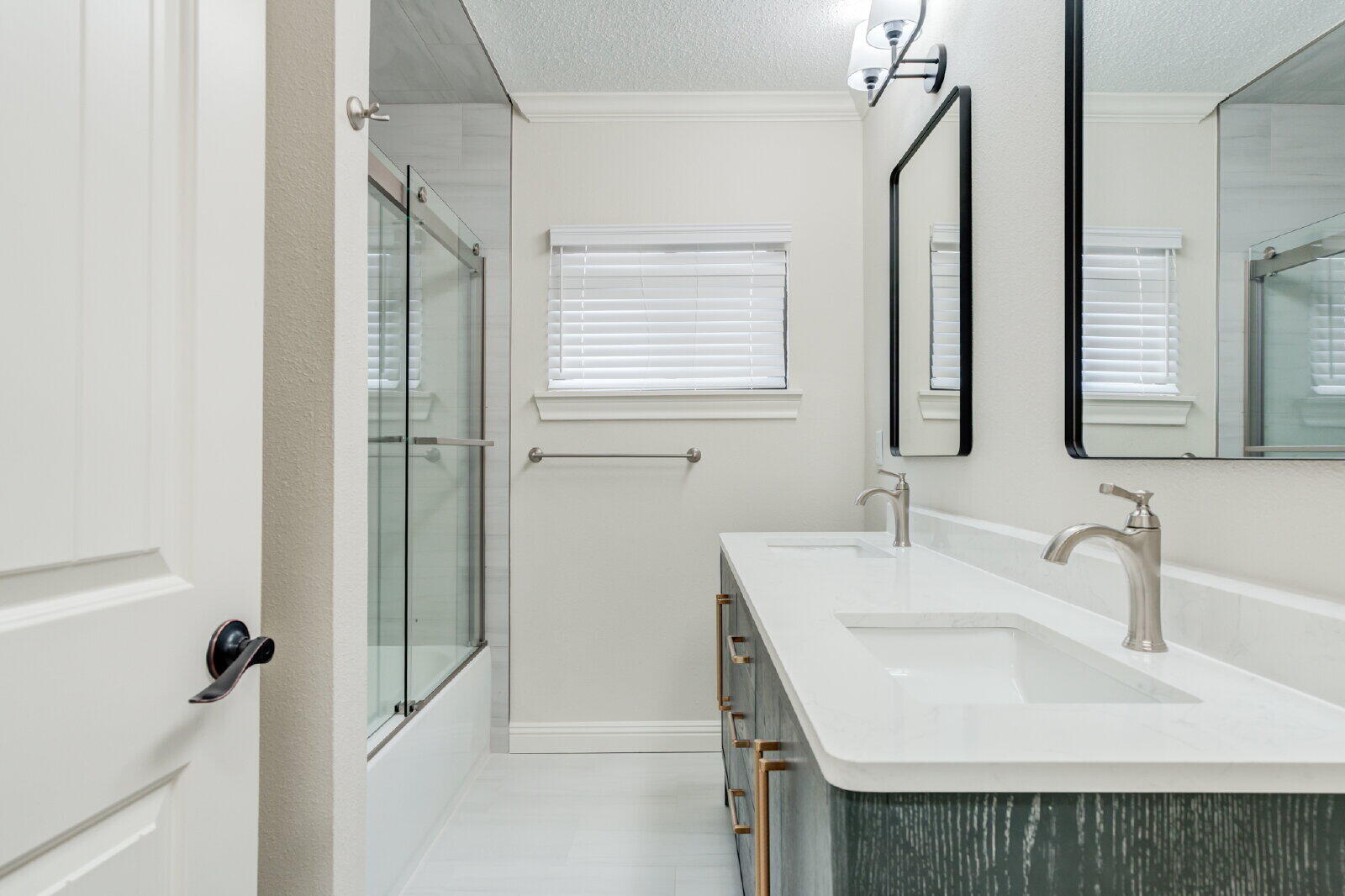 2602 24th Street Lubbock, TX 79410 - Photo 31 of 37 a bathroom with a sink and a mirror