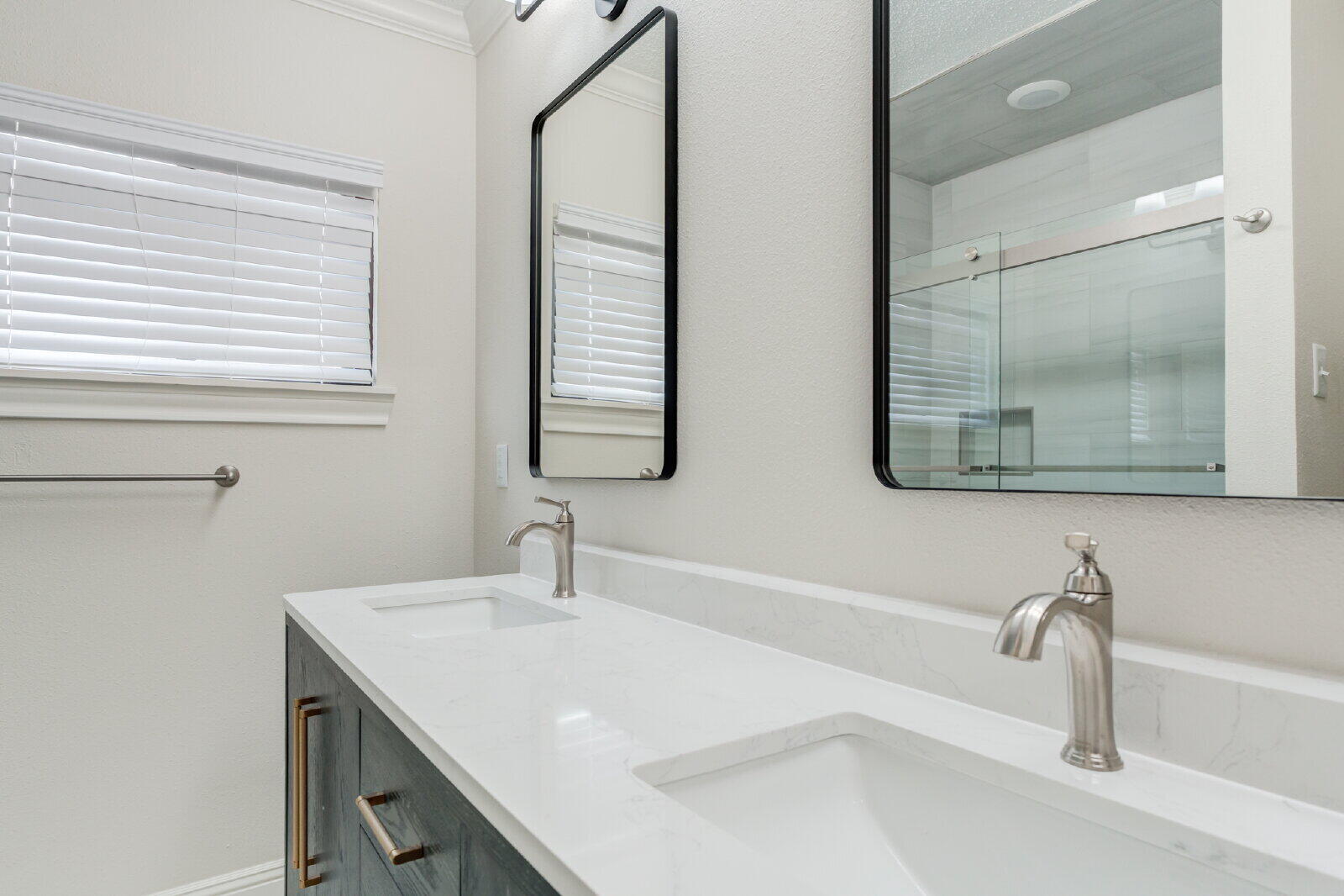 2602 24th Street Lubbock, TX 79410 - Photo 32 of 37 a bathroom with a sink and a mirror