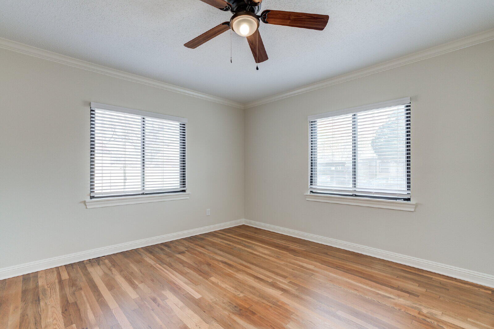 2602 24th Street Lubbock, TX 79410 - Photo 34 of 37 a view of empty room with wooden floor and fan