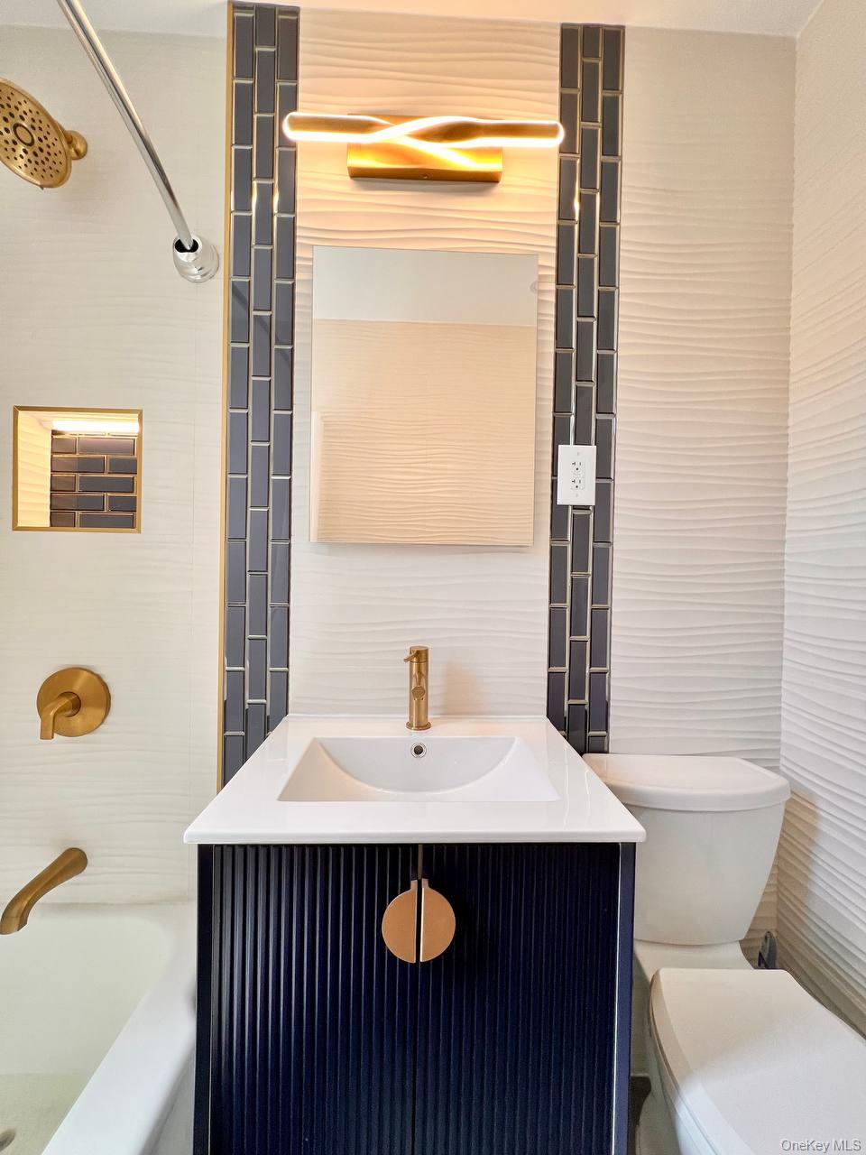 65-70 Booth Street, Unit 5E Queens, NY 11374 - Photo 5 of 5 a bathroom with a sink a toilet and shower