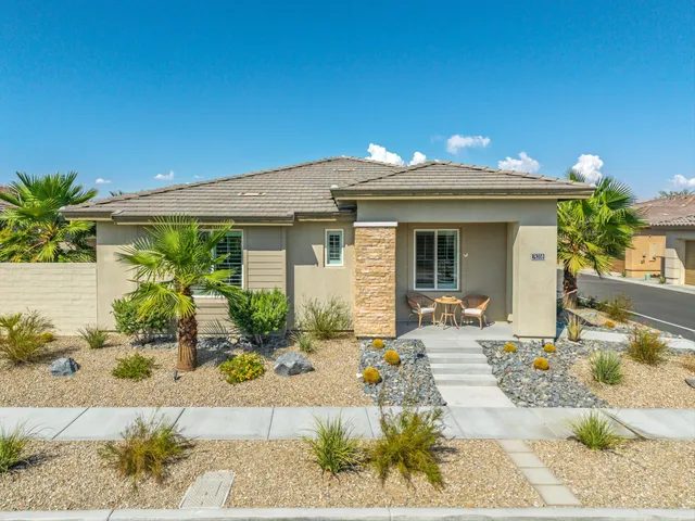 an aerial view of a house with a ocean view