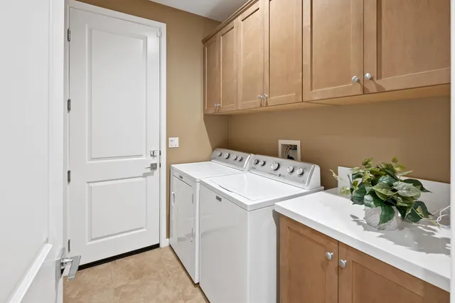 a view of a patio with couches chairs and a potted plant