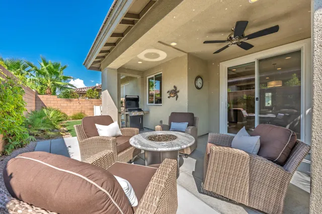 a view of houses with an outdoor space and seating