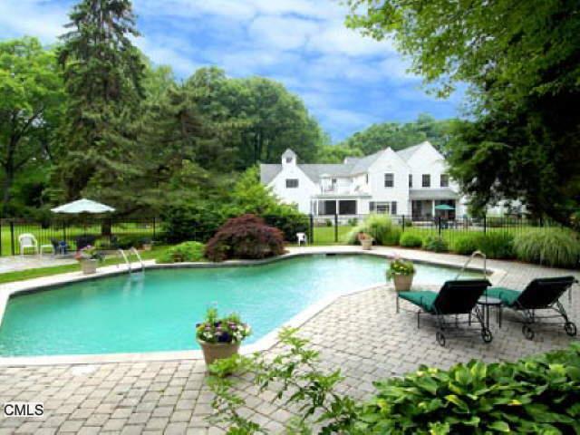 977 Sunset Road Stamford, CT 06903 - Photo 1 of 1 a view of swimming pool with outdoor seating and garden