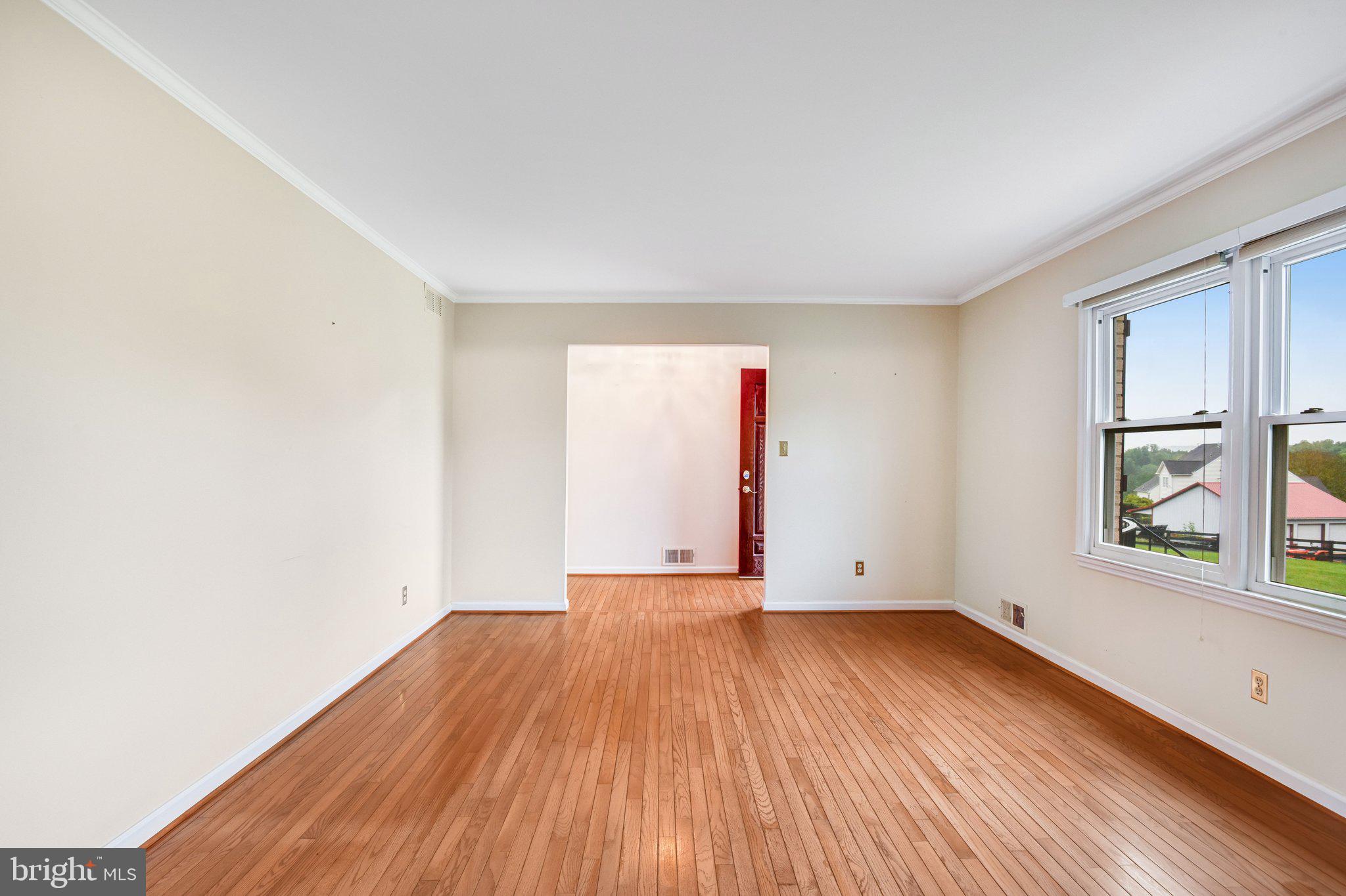 7961 Leeds Manor Road Marshall, VA 20115 - Photo 7 of 40 an empty room with wooden floor and windows