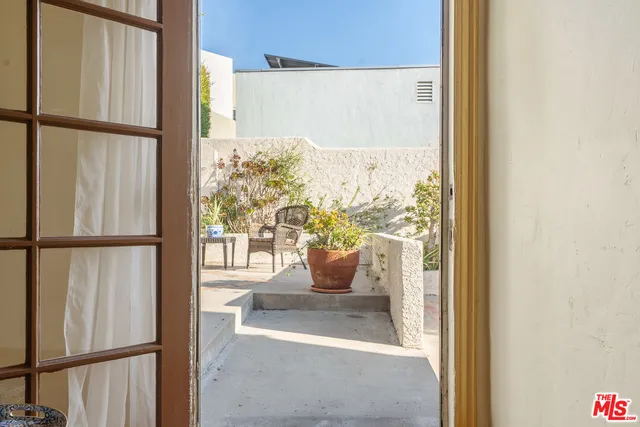 a view of a glass door with glass windows