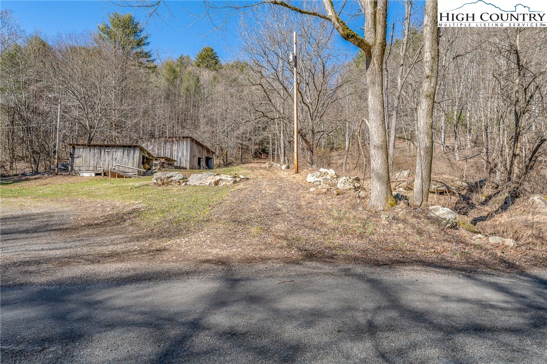Copperhead Hollow Road Butler, TN 37640 - Photo 22 of 34 a view of a yard with snow on the road