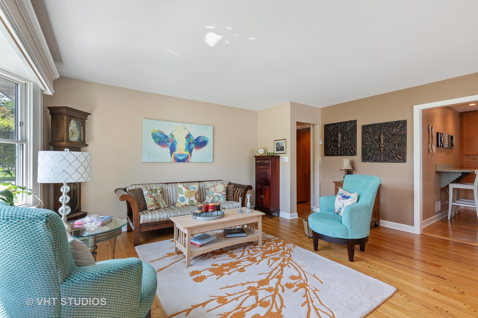 245 East St Charles Road Elmhurst, IL 60126 - Photo 2 of 18 a living room with furniture and a rug
