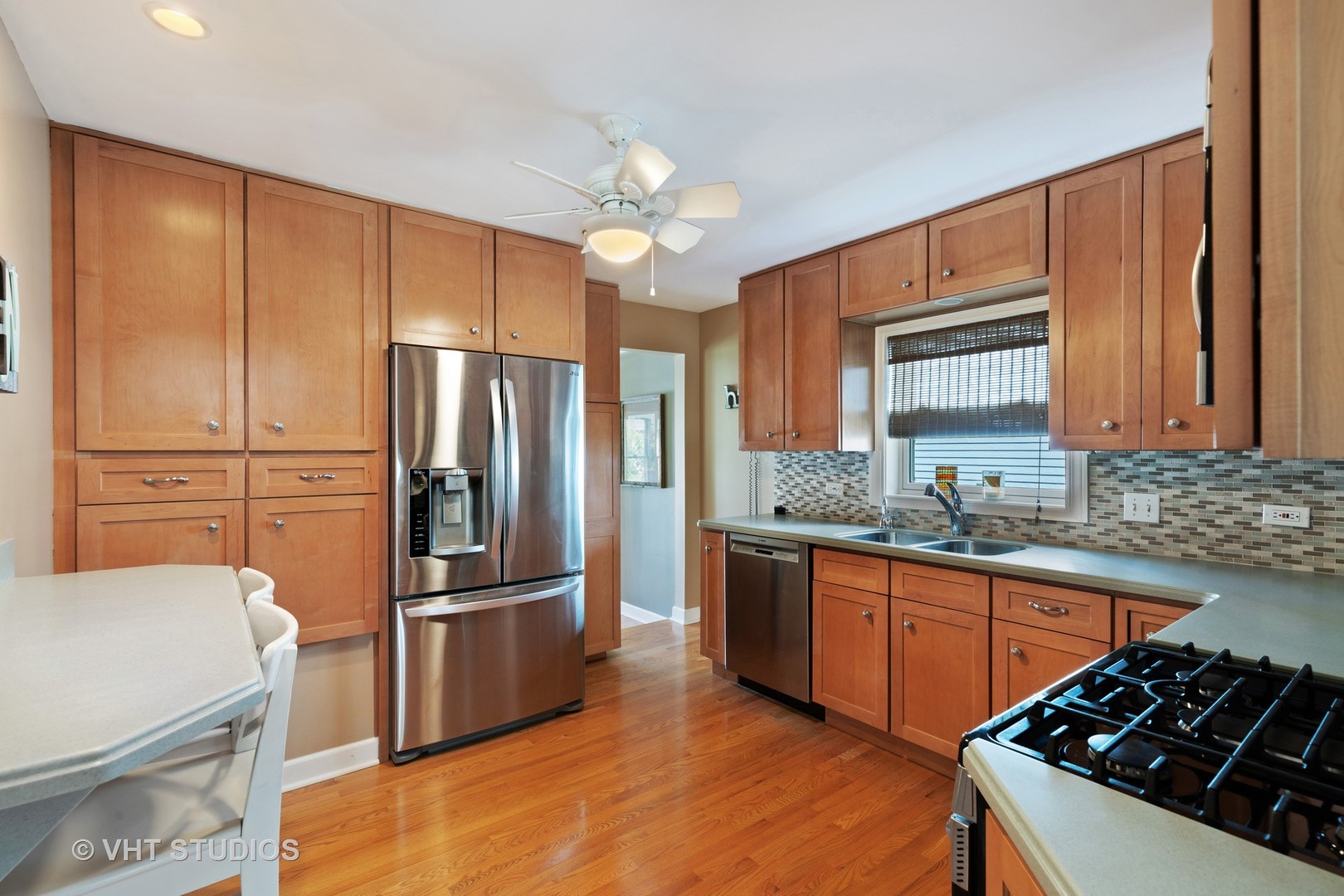 245 East St Charles Road Elmhurst, IL 60126 - Photo 4 of 18 a kitchen with stainless steel appliances granite countertop a sink stove and refrigerator