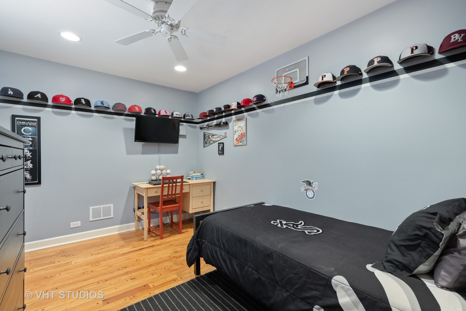 245 East St Charles Road Elmhurst, IL 60126 - Photo 10 of 18 a bedroom with a bed and cabinets